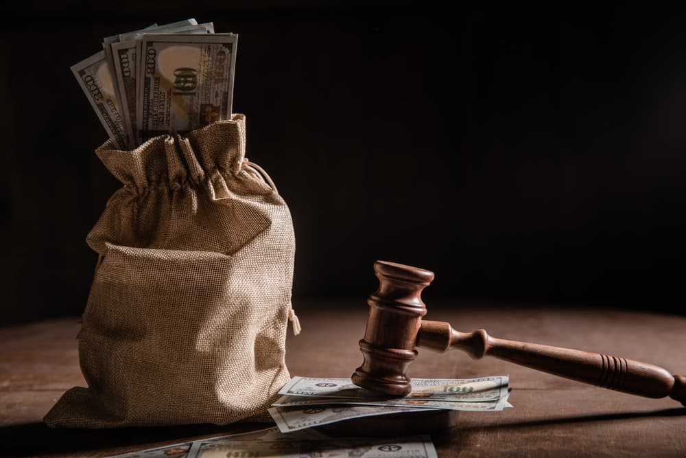 Dollar money bag and judge's gavel
