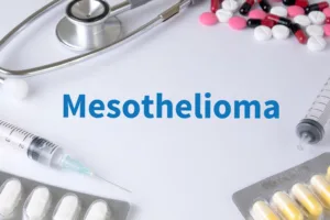 Text on a background featuring a composition of medications, a stethoscope, and a mix of therapy drugs: Mesothelioma, a rare and aggressive form of cancer, requires comprehensive treatment.
