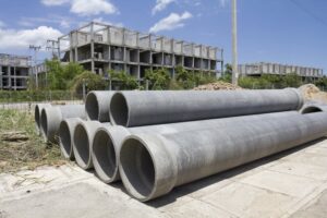 Asbestos pipes for drainage at a construction site. 