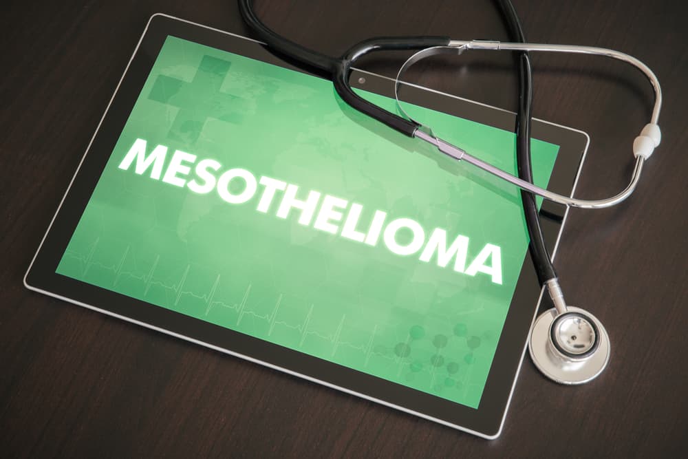 A tablet screen displaying the diagnosis "Mesothelioma (cancer type)" alongside a stethoscope, symbolizing the medical concept.