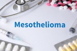 Mesothelioma text overlaid on a background of medications, including stethoscope and various therapy drugs.