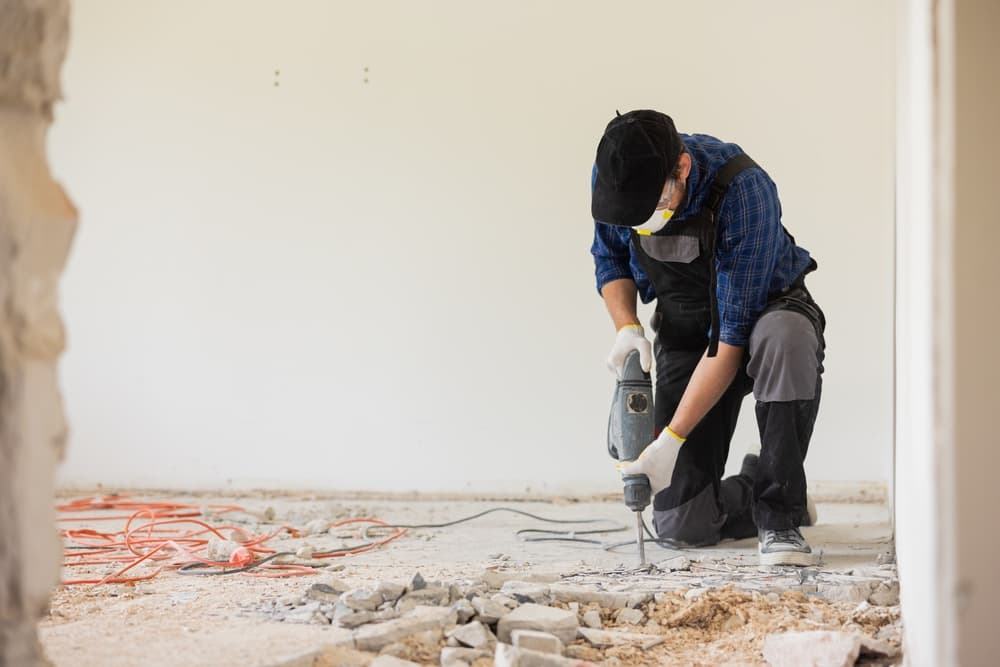 Removing a concrete floor with a hand hammer