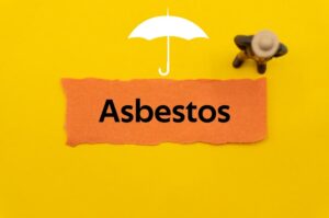 Asbestos. The word is written on a slip of colored paper.