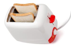 Toaster with bread inside isolated on white