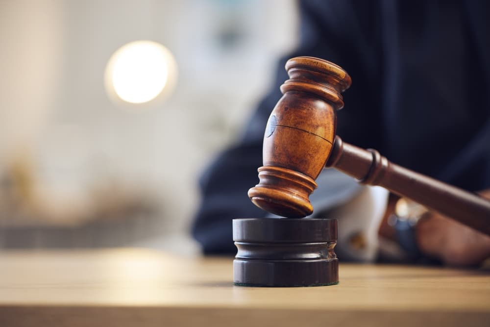 Law, judge and closeup of lawyer with gavel for justice,