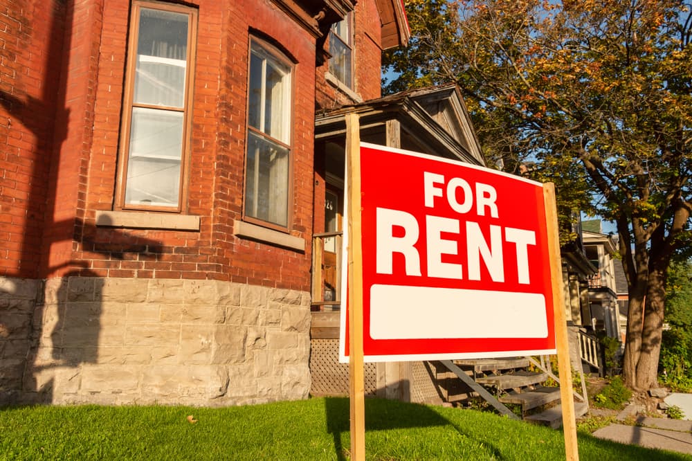 For rent sign posted in front of front porch