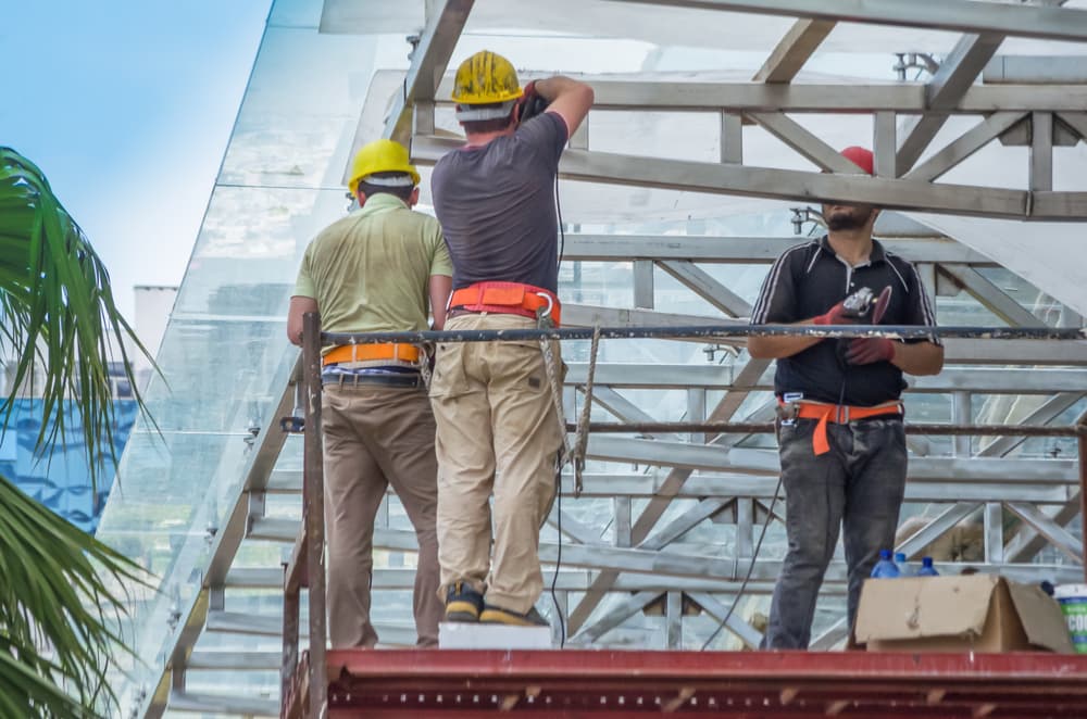 construction worker on a scaffold, symbol photo for building,